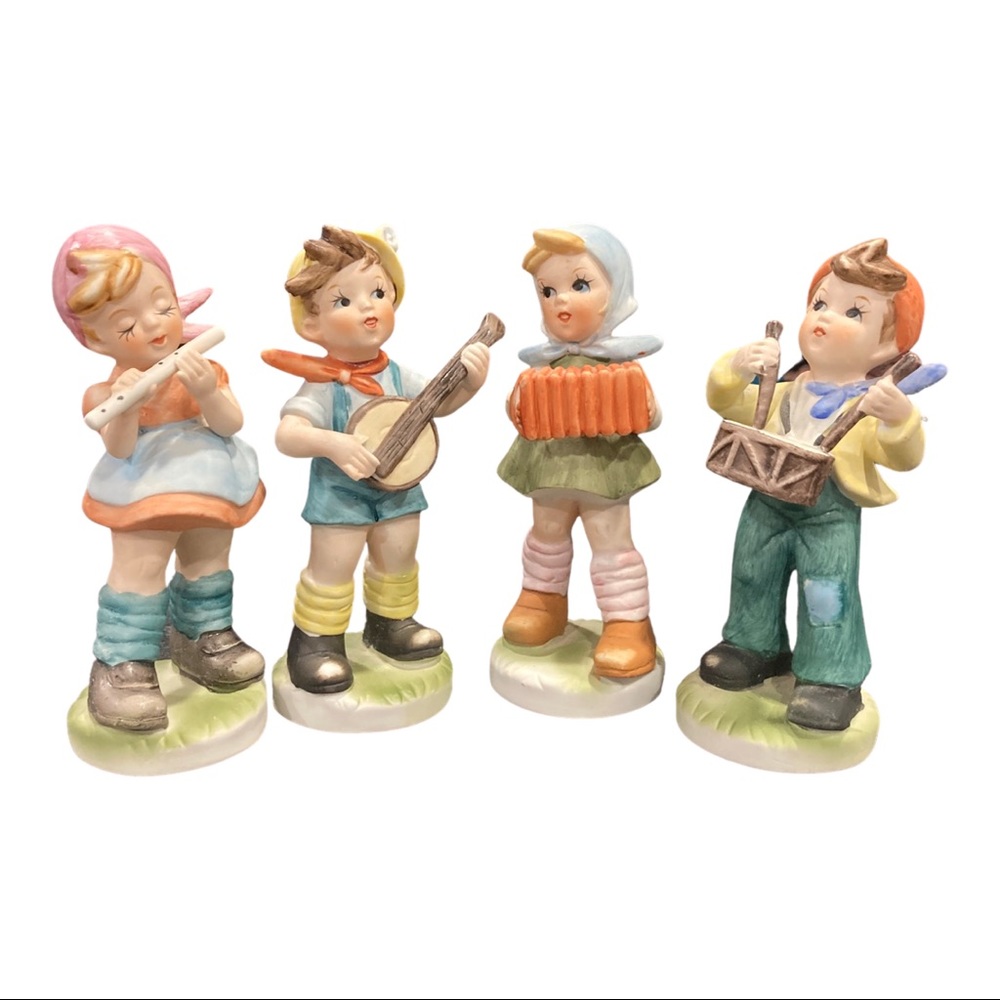 Lot of 4 vintage Homco figurines.